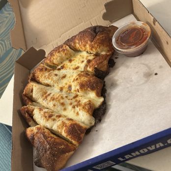 La Nova Pizzeria - Breadsticks with cheese and sauce. - Pizza Near Me - Williamsville, New York La Nova Pizzeria - Breadsticks with cheese and sauce. - Pizza Near Me - Williamsville, New York