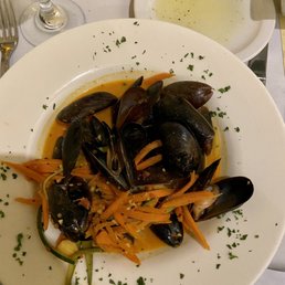 a plate of steamed mussels and carrots a plate of steamed mussels and carrots