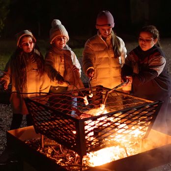 The Great Aussie Bush Camp - Toasting marshmallows by the campfire is a perfect way to wind down after a day jam-packed with activities and adventure! - Campgrounds Near Me - Tea Gardens, NSW The Great Aussie Bush Camp - Toasting marshmallows by the campfire is a perfect way to wind down after a day jam-packed with activities and adventure! - Campgrounds Near Me - Tea Gardens, NSW