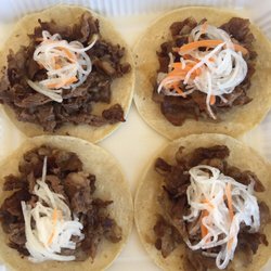 Mestizo's - KBBQ Tacos- Korean Bbq style Brisket and beef belly on a warm homemade corn tortilla. pickled daikon & carrots, served with brisket sauce .