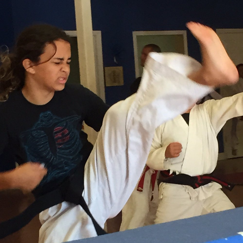 RKM Martial Arts - Working on her axe kicks. - Martial Arts Near Me - Escondido, California RKM Martial Arts - Working on her axe kicks. - Martial Arts Near Me - Escondido, California