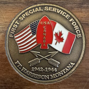 Willie's Distillery - Challenge coins inlayed in bar - Distilleries Near Me - Ennis, Montana