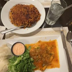 El Mamposteao - Creole Mahi-Mahi, Mashed potatoes and Parmesan Mahi-Mahi, fried bananas with Yellow Rice and beans on the side.