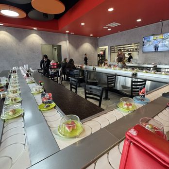Sushi Fever - View of dining area - there are both booth and bar seating options. Booths are kind of tight for 4 but it's doable. - Conveyor Belt Sushi Near Me - Albuquerque, New Mexico