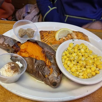 Texas Roadhouse - 8oz baked salmon with sweet potatoe accompanied by Cinnamon butter & sweet corn. - Steakhouses Near Me - Parlin, New Jersey