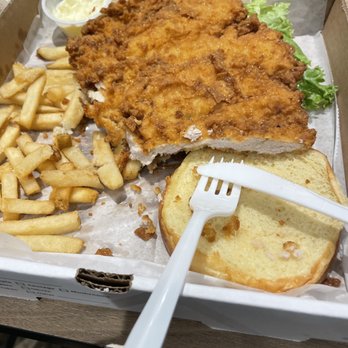 Fire By The Monon - Pork tenderloin sandwich (half eaten) to go - American Near Me - Indianapolis, Indiana Fire By The Monon - Pork tenderloin sandwich (half eaten) to go - American Near Me - Indianapolis, Indiana