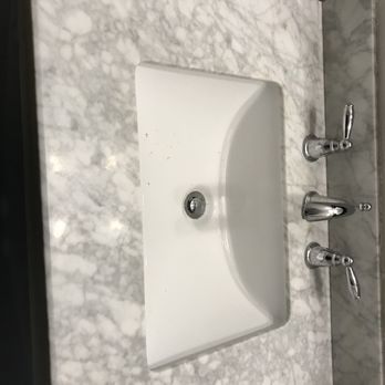 Rigo's Stone - Powder room vanity before clean, seal and polish. Old caulking has already been removed. - Flooring Near Me - Las Vegas, Nevada Rigo's Stone - Powder room vanity before clean, seal and polish. Old caulking has already been removed. - Flooring Near Me - Las Vegas, Nevada