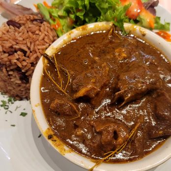 Konoko Restaurant - The GOAT with rice and peas and side salad - Caribbean Near Me - White Marsh, Maryland Konoko Restaurant - The GOAT with rice and peas and side salad - Caribbean Near Me - White Marsh, Maryland