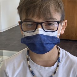 Aegis Eyecare - My son trying on glasses for the first time