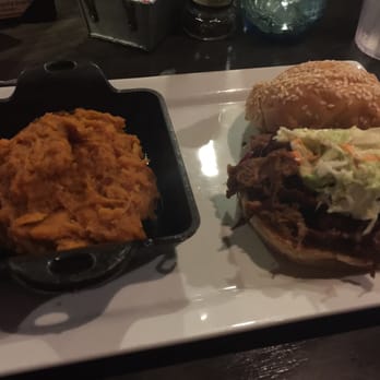 The Row - Pork sandwich with bourbon sweet potatoes - Southern Near Me - Nashville, Tennessee The Row - Pork sandwich with bourbon sweet potatoes - Southern Near Me - Nashville, Tennessee