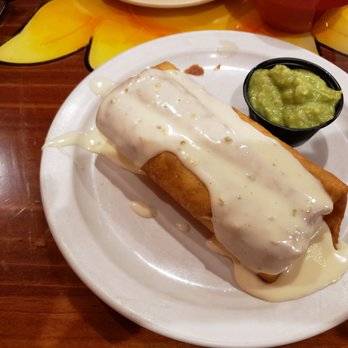 Cancun Mexican Grill - Solo chimichanga smothered in cheese dip with a taste of guacamole on the side - Mexican Near Me - Bonifay, Florida