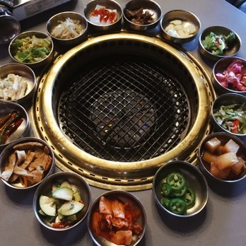 Kook Korean BBQ - the empty grill surrounded by banchan - Korean Near Me - Vancouver, British Columbia Kook Korean BBQ - the empty grill surrounded by banchan - Korean Near Me - Vancouver, British Columbia
