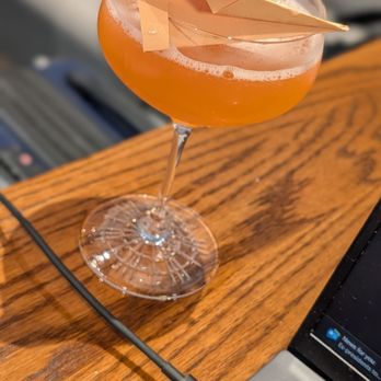 Vino Volo - Gate C1 - Paper Plane Cocktail (Bourbon, Aperol, Amaro Nonino,  and lemon juice) - Wine Bars Near Me - Jacksonville, Florida