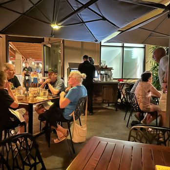 Monkeypod Kitchen by Merriman - One of the outdoor seating areas - New American Near Me - Kihei, Hawaii Monkeypod Kitchen by Merriman - One of the outdoor seating areas - New American Near Me - Kihei, Hawaii