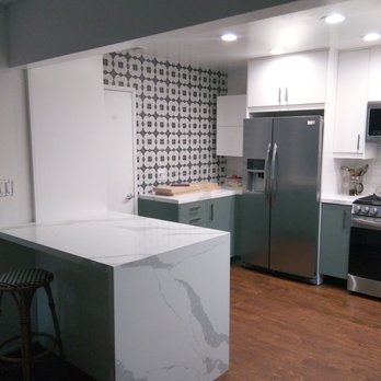 Joe Runkle Construction - a kitchen with a marble island - General Contractors Near Me - Costa Mesa, California Joe Runkle Construction - a kitchen with a marble island - General Contractors Near Me - Costa Mesa, California