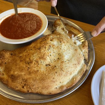 Enzo's - The SMALL calzone!!!!!! I'd love to see how big the large is. As tasty as it is in size. - Italian Near Me - Sunrise, Florida Enzo's - The SMALL calzone!!!!!! I'd love to see how big the large is. As tasty as it is in size. - Italian Near Me - Sunrise, Florida
