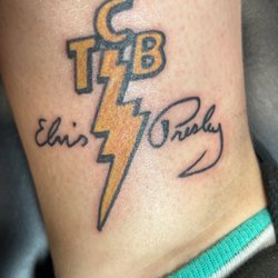 Liquid Tattoo - Elvis' logo that he designed himself and his signature