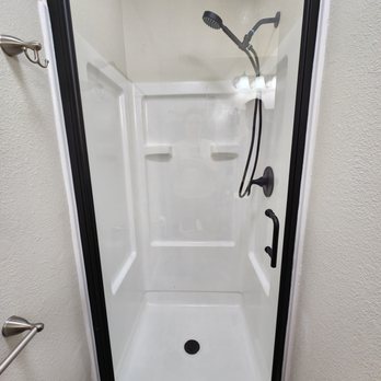 Shower Mama - Look at the transformation! They refinished the stall, and installed a new door and new fixtures! - General Contractors Near Me