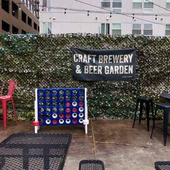 Black Shirt Brewing - Another view of the beer garden & games. - Breweries Near Me - Denver, Colorado