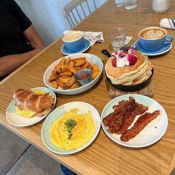 Bluestone Lane - Lemon Ricotta Pancakes, Bacon, Egg & Cheese Croissant, Side Wedges, Side Bacon, Side of Scrambled Eggs - Coffee & Tea Near Me - Orange, California
