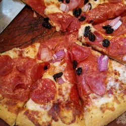 Pizza Hut - Hand tossed crust with garlic sauce that I didnt request, salami, dried out not evenly placed black olive, peperoni, and onions.