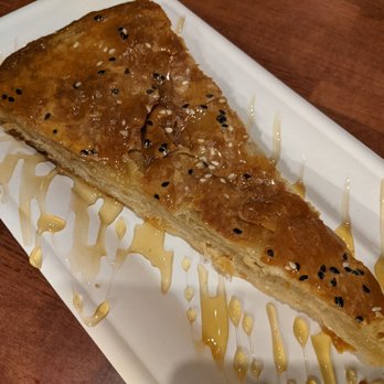 Qahwah House - Sabaya. A flaky multilayer pastry dessert not unlike baklava. Served with honey - Coffee & Tea Near Me - Dearborn, Michigan Qahwah House - Sabaya. A flaky multilayer pastry dessert not unlike baklava. Served with honey - Coffee & Tea Near Me - Dearborn, Michigan