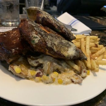 Earls Kitchen + Bar - BBQ Ribs and Cajun Chicken with Truffle Fries and warm potato salad - New American Near Me - McLean, Virginia Earls Kitchen + Bar - BBQ Ribs and Cajun Chicken with Truffle Fries and warm potato salad - New American Near Me - McLean, Virginia
