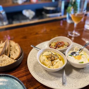 Smyrna - Meze Trio $18, extra bread (we got 4) $6/each - Mediterranean Near Me - Charlottesville, Virginia Smyrna - Meze Trio $18, extra bread (we got 4) $6/each - Mediterranean Near Me - Charlottesville, Virginia