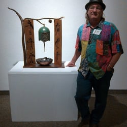 The Gallery In Williams - Tom Williams, co-owner and metal sculpture with his bell "Resonance".