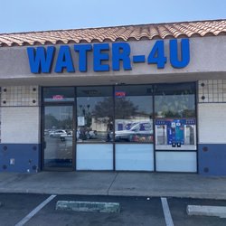 Water-4U - Open signs during regular business hours, yet they are not open.