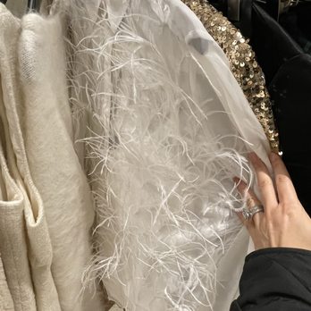 J.Crew - Various luxurious fabrics are displayed, including feathered, sequined, and plush textiles, likely for fashion or special occasion garments. - Men's Clothing Near Me - Austin, Texas