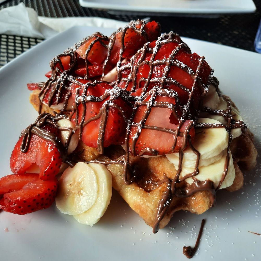 Syrup Trap - Original waffle with strawberries, bananas, and nutella ($11.75)...yum! - Breakfast & Brunch Near Me - Vancouver, Washington Syrup Trap - Original waffle with strawberries, bananas, and nutella ($11.75)...yum! - Breakfast & Brunch Near Me - Vancouver, Washington