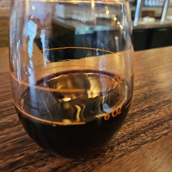 Kegger Burger - a glass of wine on a wooden table - Burgers Near Me - Pontiac, Michigan Kegger Burger - a glass of wine on a wooden table - Burgers Near Me - Pontiac, Michigan