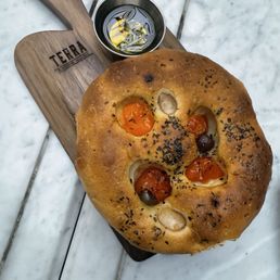 Housemade Focaccia, Cherry Tomatoes, Castelvetrano Olives Housemade Focaccia, Cherry Tomatoes, Castelvetrano Olives