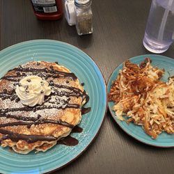 Star 34 Cafè - Short stack of chocolate chip pancakes with a side of hashbrowns