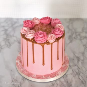 Turtles Bakeree - a pink cake with chocolate drips - Desserts Near Me