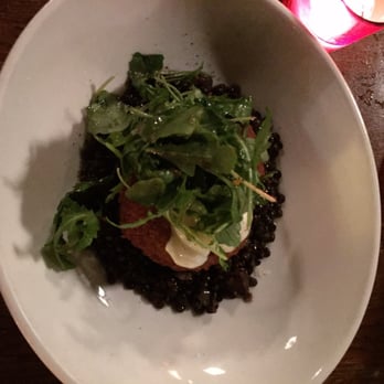 Stanbury - the famous crispy pig head with mustard cream, arugula, and lentils. - New American Near Me - Raleigh, North Carolina Stanbury - the famous crispy pig head with mustard cream, arugula, and lentils. - New American Near Me - Raleigh, North Carolina