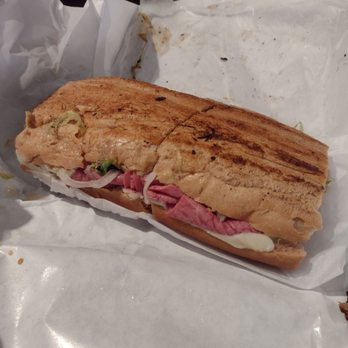 Hogan's Great Sandwiches - Half of a 12" corned beef and provolone sandwich - Sandwiches Near Me - Gainesville, Florida Hogan's Great Sandwiches - Half of a 12" corned beef and provolone sandwich - Sandwiches Near Me - Gainesville, Florida