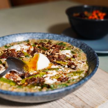 Kantine - Savory Grain Porridge with Runny Egg and Bacon Bits (+$2 respectively) - Scandinavian Near Me - San Francisco, California Kantine - Savory Grain Porridge with Runny Egg and Bacon Bits (+$2 respectively) - Scandinavian Near Me - San Francisco, California