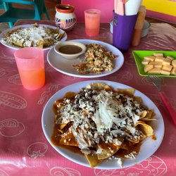 La Patrona - Chilaquiles Rojos with arrechera, melón, and juice, also Huevos and chilaquiles verde with coffee