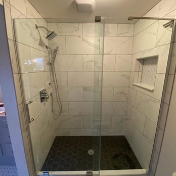 Charles Weiss Contracting - a shower with a glass door - General Contractors Near Me