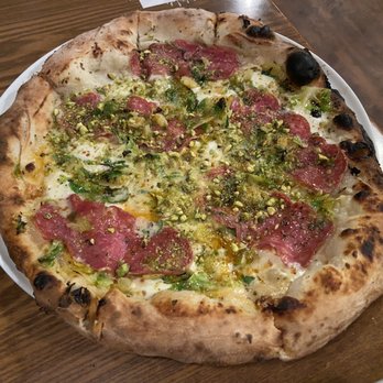 Fat Olives - Their famous pizza recommended by guy fierri on tv, but it was very greasy and way too spicy for me to eat. - Pizza Near Me - Flagstaff, Arizona