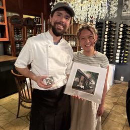 Chef Jake and watercolor artist Avery Cadence showing off her painting of the restaurant Chef Jake and watercolor artist Avery Cadence showing off her painting of the restaurant