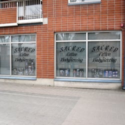 Sacred Tattoo - Sacred Tattoo & Bodypiercing