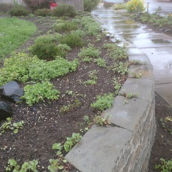 Skyscape Construction - The Great Block Wall of the west side, Install. Unshakable - inches of compacted  rock base, drainage, mucho adhesive, living capstone - General Contractors Near Me