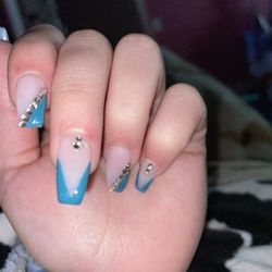 Jenny's Nails - More cuts. The middle was bleeding while there and on my pinky she filed too hard so it created those cuts.