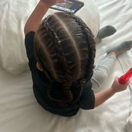 My daughters very first braids. My daughters very first braids.