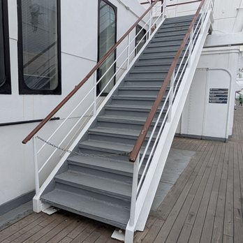 The Queen Mary - Stairs to an inaccessible upper deck - Hotels Near Me - Long Beach, California The Queen Mary - Stairs to an inaccessible upper deck - Hotels Near Me - Long Beach, California