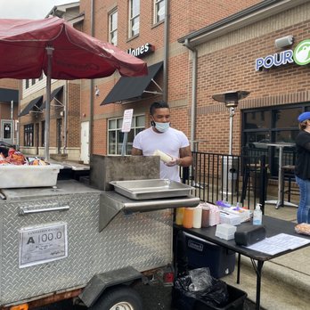 Q’s Culinary Cart - a man preparing food - Hot Dogs Near Me
