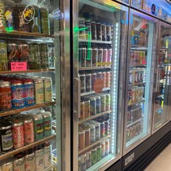 Elmira Liquors - Check out this craft beer selection though. That's just 1 side...